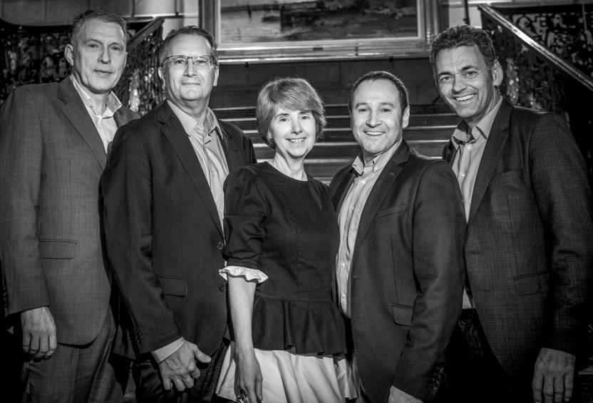 Posed black and white photo of part of the Liberty Specialty Markets Central leadership team